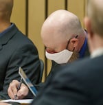 Russell Schultz III takes notes during trial on Monday, July 18, 2022, in Multnomah County Circuit Court. Schultz, MacKenzie Lewis and Joey Gibson, are facing charges for allegedly instigating a street fight between Patriot Prayer and anti-fascists on May 1, 2019, at the now-closed bar Cider Riot.