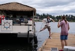 A boat hand docks the shuttle boat at Elk Rock Island, the launch point of the float. 