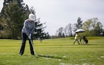 Bobbi Brown readies her swing at RedTail Golf Center in Beaverton, Ore., on April 11, 2024. RedTail is popular for its driving range and the classes it offers.