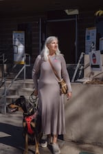 Adelaide Stone Van Gessel stands with her dog, Guinness, outside of the Oakwood Community Center and voting site in the Venice neighborhood of Los Angeles.