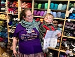 Laura Walthinsen of Portland and her son Aidan, 3, received her 11th and final 2018 Rose City Yarn Crawl passport stamp at the Knitting Bee in deep Southwest Portland. The Bee was her sixth and last stop on her third day, qualifying her for the event’s randomly selected grand prizes.  