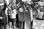 In a demonstration for gay rights, protestors march through a French Quarter street on their way to the concert hall at which singer Anita Bryant performed in New Orleans, June 18, 1977.