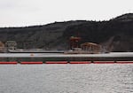 A view of the selective water withdrawal tower from behind Round Butte Dam. The 273-foot underwater device mixes warm reservoir surface water with cold bottom water. 