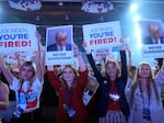 People arrive before Republican presidential candidate former President Donald Trump speaks at the "People's Convention" of Turning Point Action Saturday in Detroit.