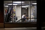 A man works out in a gym at an apartment building in downtown Seattle, Sunday, March 15, 2020.