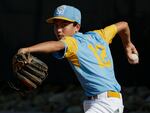 SOUTH WILLIAMSPORT, PENNSYLVANIA - AUGUST 28: Daly Watson #12 of the West Region team from Honolulu, Hawaii warms up in the bullpen during the third inning of the Little League World Series Championship game against the Caribbean Region team from Willemstad, Curacao at the Little League International Complex on August 28, 2022 in South Williamsport, Pennsylvania. (Photo by Joshua Bessex/Getty Images)