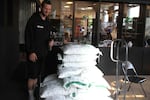 Firehouse Glass studio manager Andrew Lueck and his stash of Spectrum cullet.