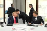United States Secretary of State Marco Rubio, center, speaks with U.S. President Donald Trump, left, during a working session at the G7 summit in Evian-les-Bains, France, Tuesday, June 16, 2026.