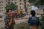 Irina Shulimova, 59, weeps at the scene of a Russian strike that hit her apartment building in eastern Ukraine.