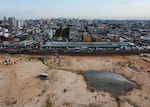 A part of the Negro River is dry at the port in Manaus, Amazonas state, Brazil, Friday, Oct. 4, 2024, amid severe drought.