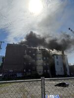 Smoke rises from an apartment fire in Southwest Portland, Ore., on May 16, 2023, in this provided photo from Portland Fire & Rescue.