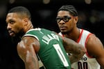 FILE - Portland rookie guard Scoot Henderson guards the Bucks' Damian Lillard in a game Nov. 26, 2023, in Milwaukee. Lillard will return to Portland for the first time as a Buck on Wednesday, Jan. 31.