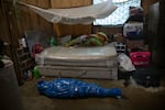 Corazona Pena's body lies wrapped in plastic by a Peruvian COVID-19 specialized government team in Pucallpa, in Peru's Ucayali region, Tuesday, Sept. 29, 2020. The global death toll from COVID-19 has topped 2 million. It took eight months to hit 1 million lives lost. It took less than four months after that to reach the next million.