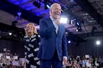 President Joe Biden, right, and first lady Jill Biden walk off stage after speaking at a campaign rally, Friday, June 28, 2024, in Raleigh, N.C.