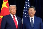 President Donald Trump, left, and Chinese President Xi Jinping pose together ahead of their summit talk at Gimhae International Airport in Busan, South Korea, on Thursday.