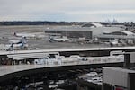 FILE - Hawaiian and Alaska Airlines airplanes are seen parked at gates at Seattle-Tacoma International Airport, Nov. 6, 2025, in SeaTac, Wash.