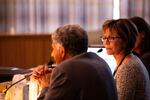 Oregon Child Welfare director Marilyn Jones, right, listens to Department of Human Services director Fariborz Pakseresht deliver testimony before the Senate Human Services Committee Thursday, April 10, 2019, at the Capitol in Salem, Ore.