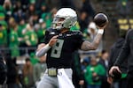 Oregon quarterback Dillon Gabriel warms up before an NCAA college football game against Washington, Saturday, Nov. 30, 2024, in Eugene, Ore.