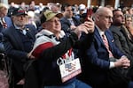 Scott Stoyan, of Augusta, Ga., watches Pete Hegseth, President-elect Donald Trump's choice to be Defense secretary, appear before the Senate Armed Services Committee for his confirmation hearing, at the Capitol in Washington, Tuesday, Jan. 14, 2025.