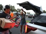 Volunteers with King's Cathedral Maui bring in donations on Aug. 10, 2023 in Kahului, Hawaii.