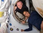 In this photo provided by NASA, Boeing Crew Flight Test astronauts Butch Wilmore (left) and Suni Williams pose for a portrait inside the vestibule between the forward port on the International Space Station's Harmony module and Boeing's Starliner spacecraft on June 13.