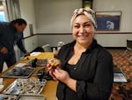 Sadie Mildenberger holding Elderberry Crumble muffins.