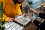 A customer smells a strain of cannabis at Bridge City Collective in Portland, Ore., on Jan. 6, 2026.