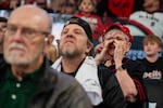 Bonnie Gardner yells as she watches the game.