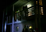 Volunteer teams check both floors of a mock apartment building for injured people during a Neighborhood Emergency Teams training scenario. The training session took place in the Portland Police Bureau's Scenario Village.