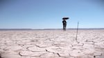 Each summer Alan Case practices flight archery in Oregon's Alvord Desert in a quest to shoot an arrow farther than any human in history. He often rides his bike more than a mile from his launching point to find his arrows.