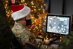 In this photo provided by the North American Aerospace Defense Command, a 22 Wing member is seen showing how they track Santa on his sleigh on Christmas evening during a media preview at the Canadian Forces Base in North Bay on Dec. 9, 2021. In a Christmas Eve tradition going on its 66th year, a wildly popular program run by the U.S. and Canadian militaries is providing real-time updates on Santa's progress around the globe -- and fielding calls from children who want to know St. Nick's exact whereabouts.