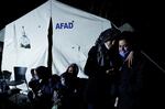 People in Antakya, Turkey, react after a new earthquake struck on Monday.