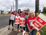 Longview school teachers begin picketing after voting to strike immediately.