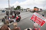 Police move on a group of protesters blocking the tracks at the BNSF Railway station in Vancouver, Washington, on Saturday, June 18, 2016.