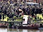 Mourners pay their respects to the late Maori King Tuheitia Pootatau Te Wherowhero VII as his coffin is carried toward the Waikato River en route to his final resting place in Hamilton, New Zealand, on Thursday.