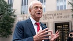 Former Trump White House official Peter Navarro talks to the media as he arrives at U.S. Federal Courthouse in Washington on Thursday.