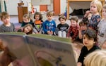 Students listen during reading time at Escuela Viva Community School’s Southeast location, Oct. 26, 2023. The bilingual child care program is part of Multnomah County’s Preschool for All.