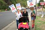 Carrie Torres, who has three daughters in the school district, spent part of the day Monday picketing with teachers in Kelso, Wash. 