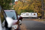 An RV sits parked at an encampment of unhoused people in Portland, Ore., on Oct. 31, 2025.