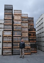 Cordell Watt, co-owner of Timber Ridge Fruit Farm in Gore, Va., poses in front of his crates.