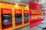 FILE - A Wells Fargo bank sign hangs outside a window on Jan. 13, 2021, in New York. Wells Fargo leaders informed Oregon officials Wednesday, Dec. 4, 2024, that next year’s office closures would impact hundreds in the Salem, Hillsboro and Portland areas.