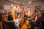 Les Zaitz, center, meets with the Malheur Enterprise news staff in 2020. The 116-year-old newspaper was purchased by Zaitz and his wife Scotta Callister in 2015, and is set to close operations on May 31.