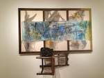 "Might". Wood, fabric, oil paint, watercolor, chair, ink, glazed ceramic. 2015. An upturned chair and scrawls of paint suggest the chaos ever-present in seemingly ordinary domestic spheres.