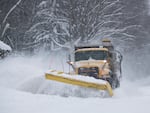 A PennDOT plow truck clears roads in northeastern Pennsylvania following snowfall of up to two feet on March 14, 2017, in Scranton. Around the country, people are participating in contests to give local snowplows clever names.