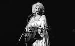 FILE - Dolly Parton performs in concert in Tokyo, July 30, 1979.