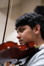Angel Alarcón García, 15, plays violin in Cindy Flores’ mariachi class at McKay High School in Salem, Ore., on March 10, 2026.