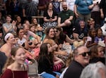 A crowd watches the pageant. 