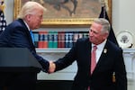 The U.S. Supreme Court has ruled that Illinois Republican U.S. Rep. Mike Bost — seen here with President Trump — has the legal standing to challenge a state law about mail ballots.