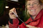Laurie Weitkamp examining the stomach contents of a chum salmon.