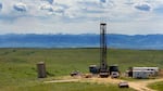 In this June 20, 2007 file photo, a natural gas drilling rig is seen outside of Wyarno, Wyo. The Trump administration eased restrictions on drilling, grazing and mining in sage grouse territory across the Intermountain West.